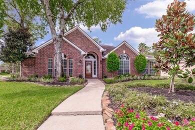 Rock lined flower beds surround this beautiful home with elevated front flower bed adds character.