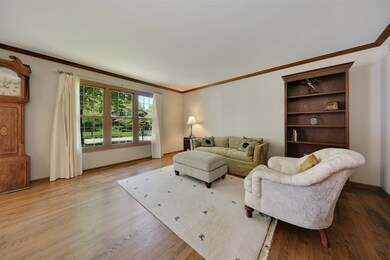 Bright formal living room with exquisite hardwood 