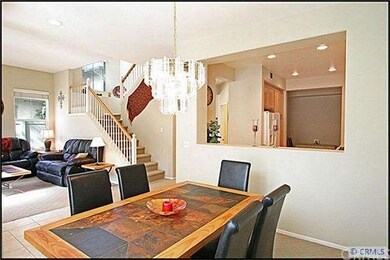 Formal dining room opens up to the kitchen and fea