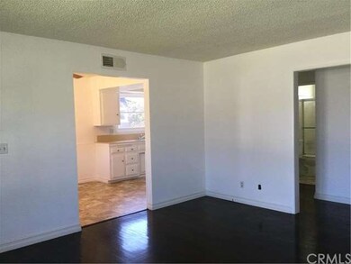 Living Room that opens to Kitchen.