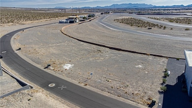 View of rural area with a mountainous background and a desert landscape