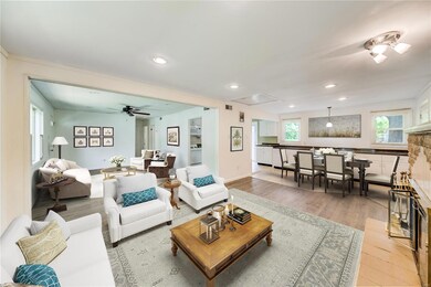 This shot of the  23 x 12 family room really shows off the versatile floor plan and other spot for dining with virtual staging.