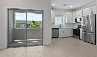 Kitchen with balcony access