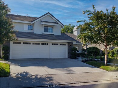 Three Car Garage with extra parking on driveway.