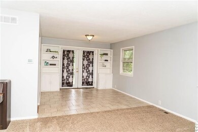 Dining room features built-ins as well as french d