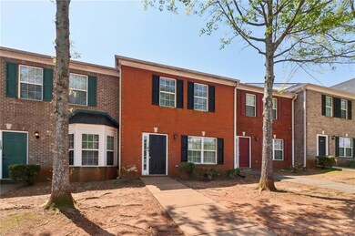 View of property featuring brick siding