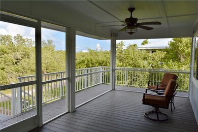 Screened entry porch provides additional living sp