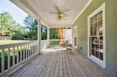 Deck featuring ceiling fan and fence