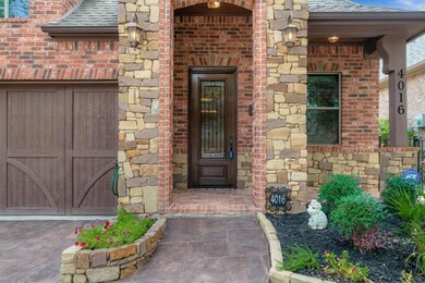 STAMPED CONCRETE DRIVEWAY, BRICK FRONT PORTCH
