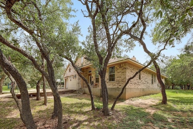 View of property exterior with a chimney, brick s
