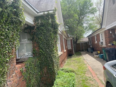 View of home's exterior with cooling unit