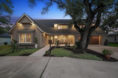 Traditional-style house with a garage, stucco sid