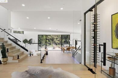 Wine cellar with wood finished floors and recessed lighting