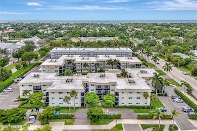 Aerial view of apartment complex and a nearby body of water