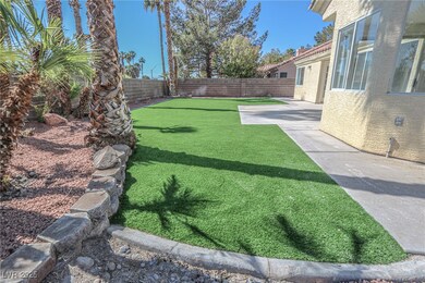View of yard with a fenced backyard and a patio ar