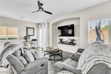 Living room featuring baseboards, wood finished fl