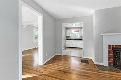 Living Room Leads to Kitchen and Dining Room
