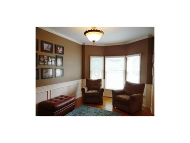 Formal Dining Room With Crown Molding, Hardwood Fl