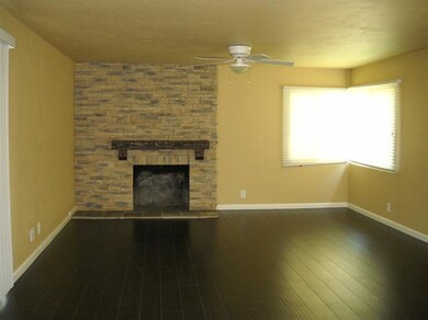 Spacious living room with new wood laminate floori