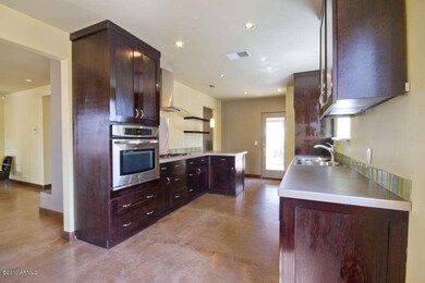 Dark Cabinetry contrasts with SS appls.