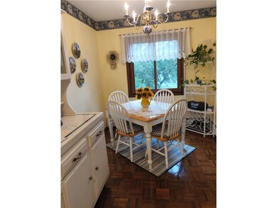 Kitchen and entry are graced with Parquet Floors