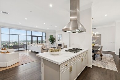 Kitchen featuring ornamental molding, island range hood, plenty of natural light, dark wood-style flooring, and open floor plan