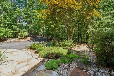 Flagstone steps and landscaping off of the driveway