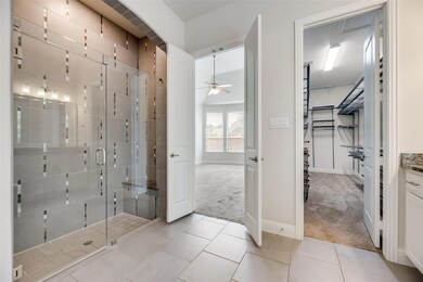 Large primary Bath with walk in shower, garden  tub and dual vanity, and large custom closet