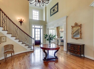 Entry -  •Two Story Grand Entrance•Extensive Trim Detail & Crown Molding distinguishes this Custom Home•Architectural Shelf above Front Door•Elegant Curved Stairwell•Hardwood Flooring•Solid Wood Front Door•