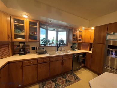 Spacious kitchen with lots of cabinets and dining