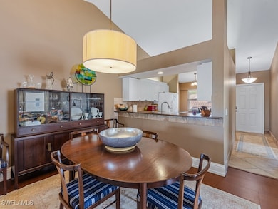 Dining space featuring vaulted ceiling and baseboa