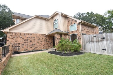 Spacious front yard with brick and iron fencing, p