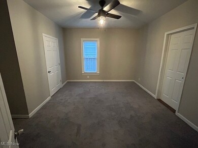 Bedroom #1 with new  carpet,  a ceiling fan, Mini blind and door to bedroom #4