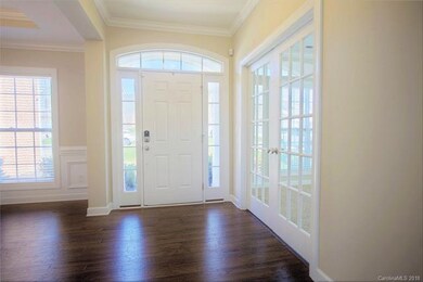 Entry with dining room on left and office or livin
