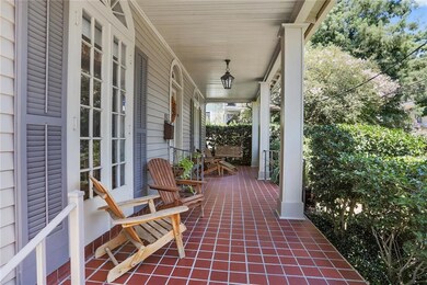 The GRACIOUS covered front porch is large enough f