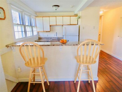 Granite countertops highlight the sunny kitchen an