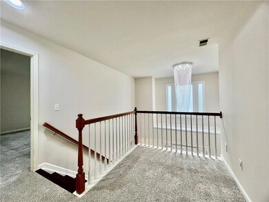 Stairway featuring carpet floors