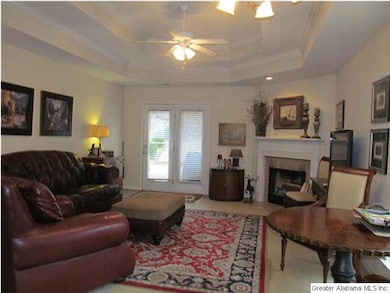Living area with fireplace and large windows