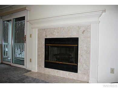 Living Room. Gas fireplace with tasteful marble ti