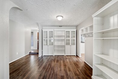 A step down from the foyer leads into this flexible-use space that was designed to serve as a dining room but could also be utilized as a home office. It is open and accessible to the foyer, kitchen, and family room.