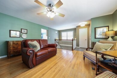 VIEW OF CUSTOM STAIRCASE LEADING TO LOWER LEVEL ME