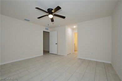 Empty room featuring ceiling fan