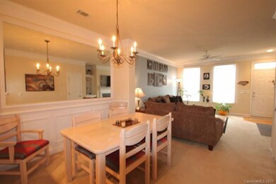 Dining area with mirrored wall and wainscoting