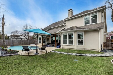 This huge backyard offers plenty of grass area for play.  Note: there is even a side yard with a gated dog run.