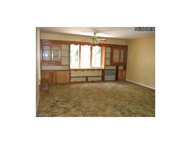 One end of the living room/dining room combo with 