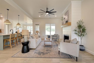 Living room with high ceilings and a statement fireplace.