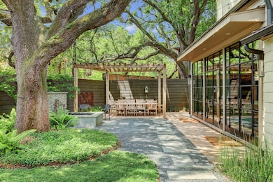 An entertainer’s dream, dine al fresco under the shade of the majestic oak trees while enjoying the soothing sounds of the trickling water feature.