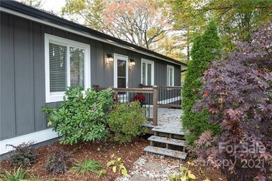 Inviting Entry Framed by Mature Trees and Shrubs