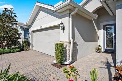 Brick driveway and walkway to covered entry