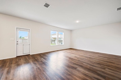 Unfurnished room featuring dark wood-style floors